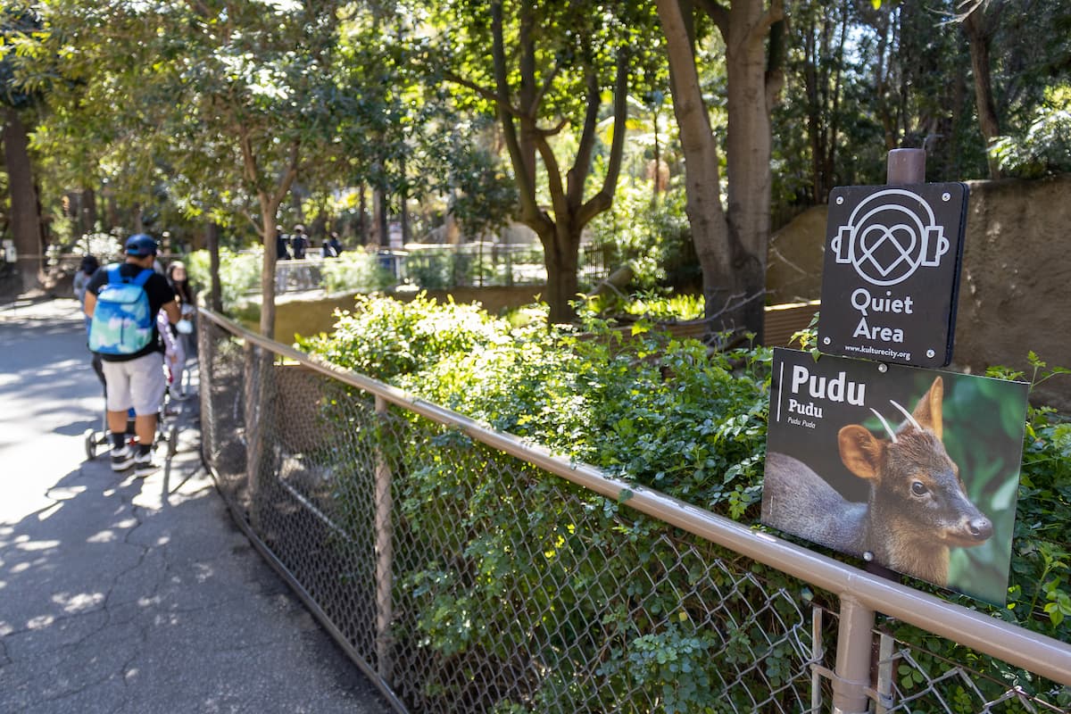 Family standing near a fence at KultureCity Quiet Location in L.A. Zoo's Australia Section