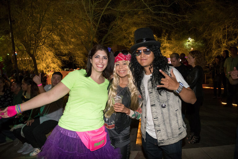 Roaring Nights People in 80s gear having a great time at Roaring Nights