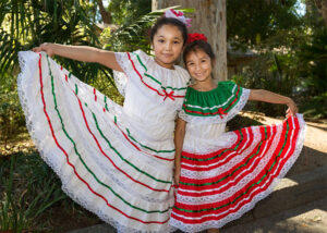 Two girls pose during the Día de los Niños / Day of the Children event at the LA Zoo.