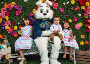 Children pose with Big Bunny at the Spring Fling celebration