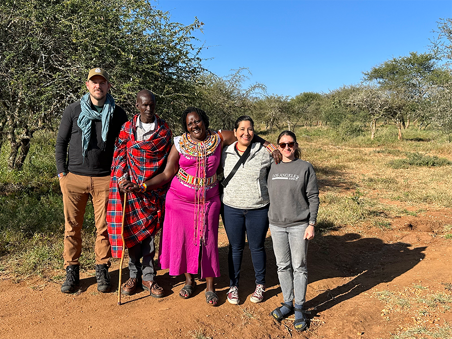 The team poses with Rosemary Nenini, manager of Twala Women's Cultural Center, and her husband, Edward.