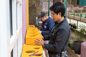 L.A. Zoo Construction Team installs custom made plant boxes at Project Pollinator HQ